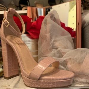 Pink croc platform heels